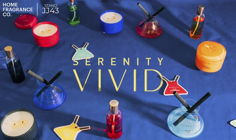 Serenity Vivid Reed Gift Fair advertisement with coloured fragrance on blue fabric